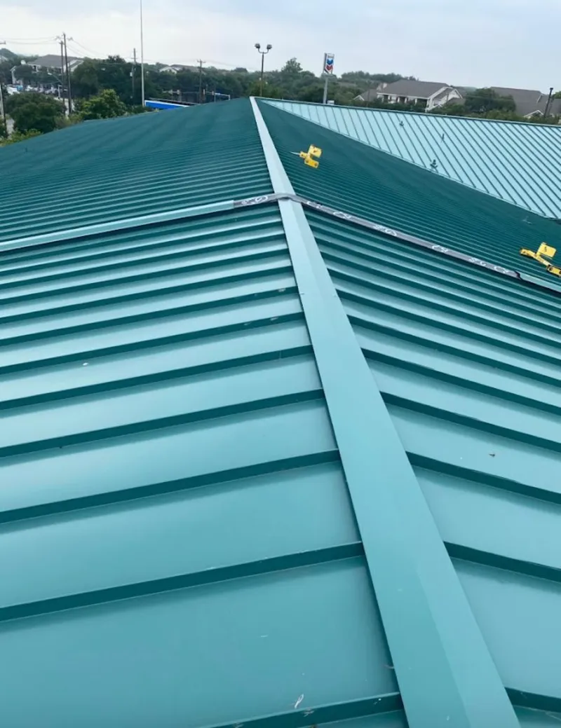 Green commercial metal roof ridge and valley for Metal Roof Repair in Elmhurst