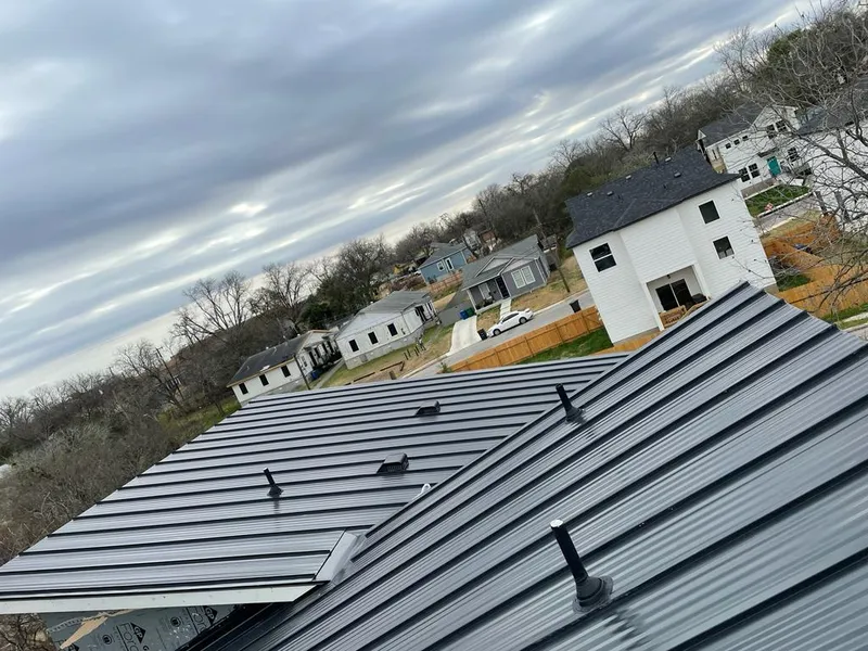 Standing seam metal roof panels with vents for Skylight Repair in Elmhurst